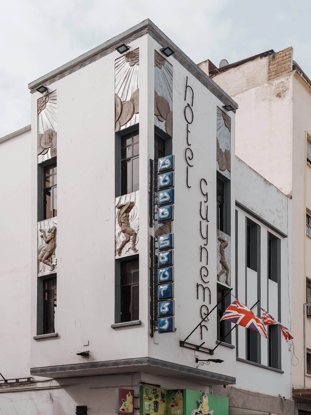 Hotel Guynemer Hotel Guynemer Art Deco facade with sunburst reliefs and athlete sculptures, Casablanca