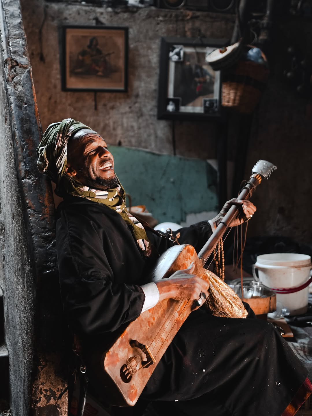 Gnawa Music Gnawa musician playing the guembri in Marrakech