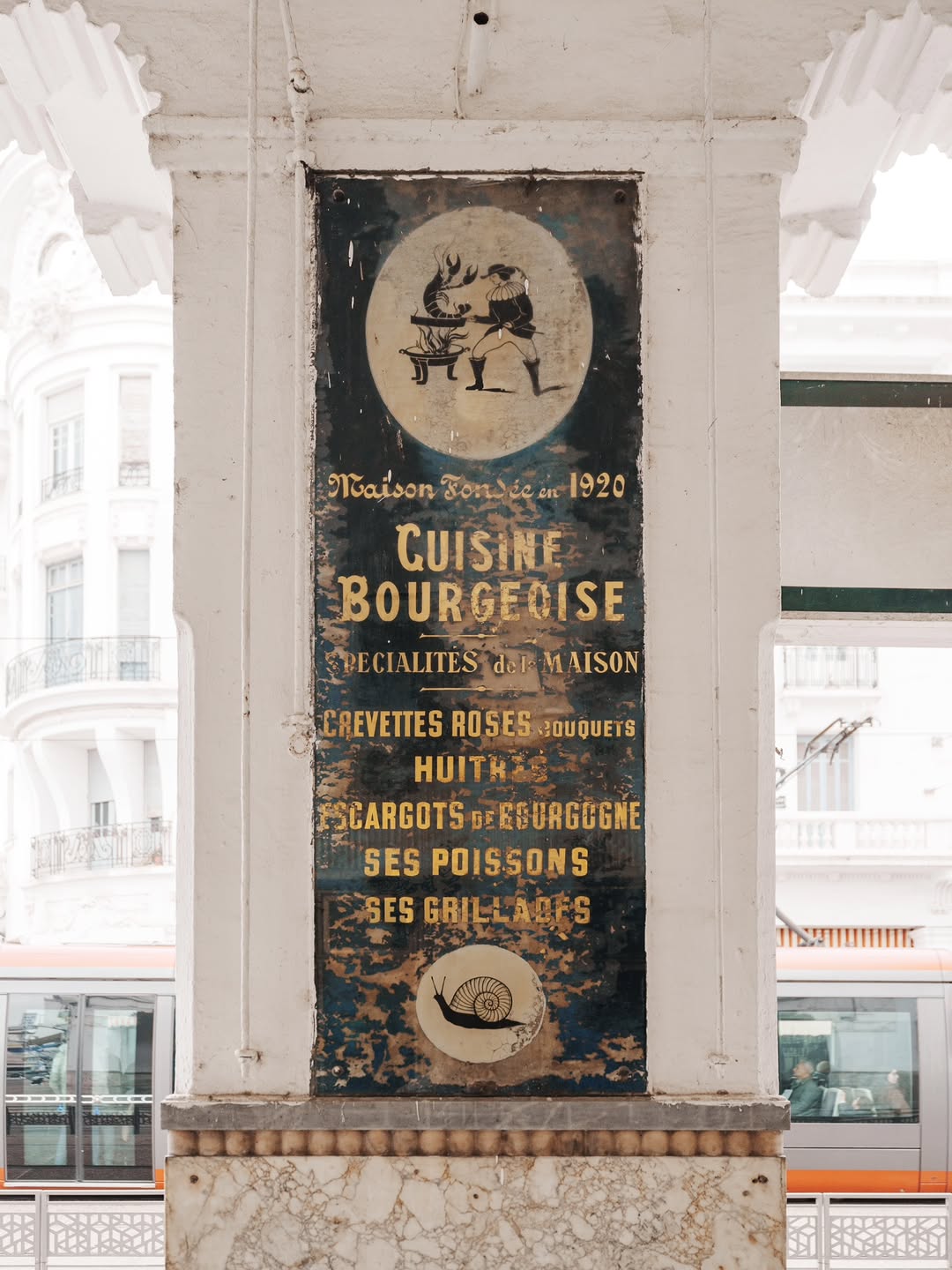 Cuisine Bourgeoise, 1920 Painted 1920 Cuisine Bourgeoise menu sign on an Art Deco arcade column in Casablanca